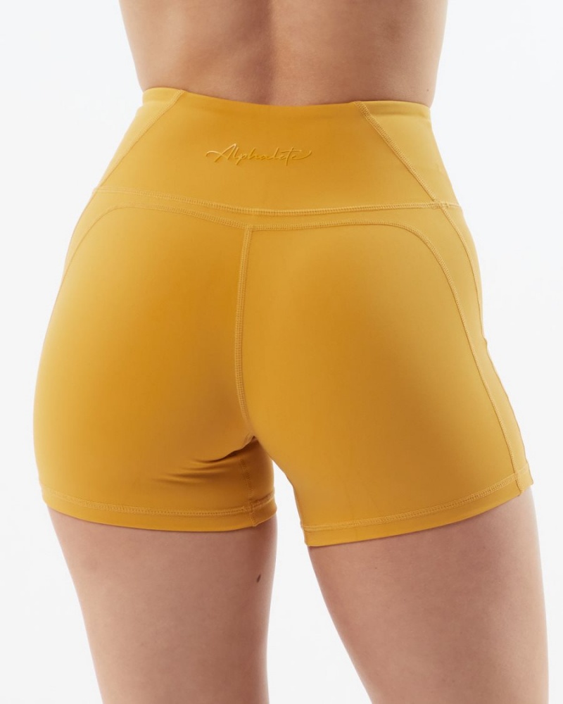 Exotic Yellow Alphalete Pulse Surge Short 4" Women's Shorts | 3897514-QP